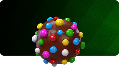 A round chocolate candy covered in colorful candy-coated pieces, displayed against a dark green diagonal-striped background.