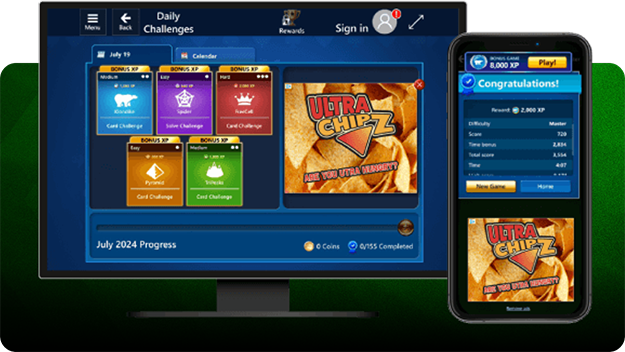Computer monitor and smartphone displaying a Solitaire game interface with daily challenges and progress tracking. The monitor shows colorful challenge tiles and an Ultra Chipz snack ad, while the phone screen displays a congratulatory message with game stats and the same Ultra Chipz branding. Both are set against a green gradient background. 