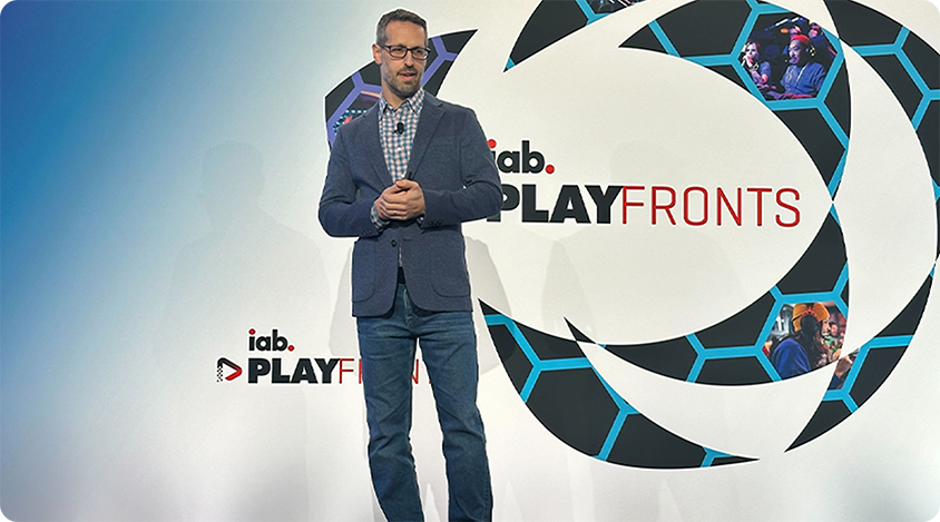 Jordan Shlachter speaks on stage at PlayFronts 2025
