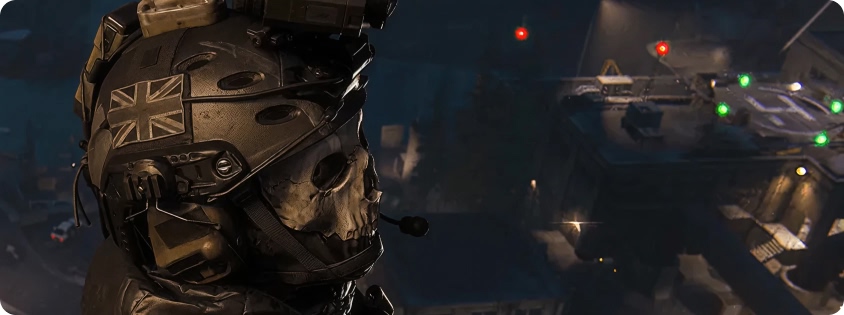 Game scene: masked soldier in tactical equipment standing above an illuminated industrial complex at night 