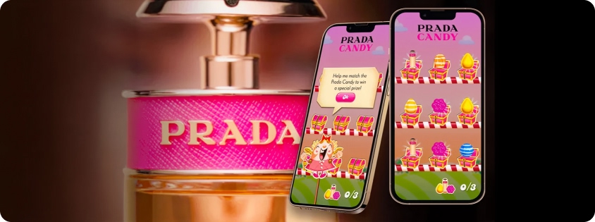 Two smartphones showing a Prada Candy-Candy Crush Saga themed playable ad beside a close-up of a Prada Candy perfume bottle